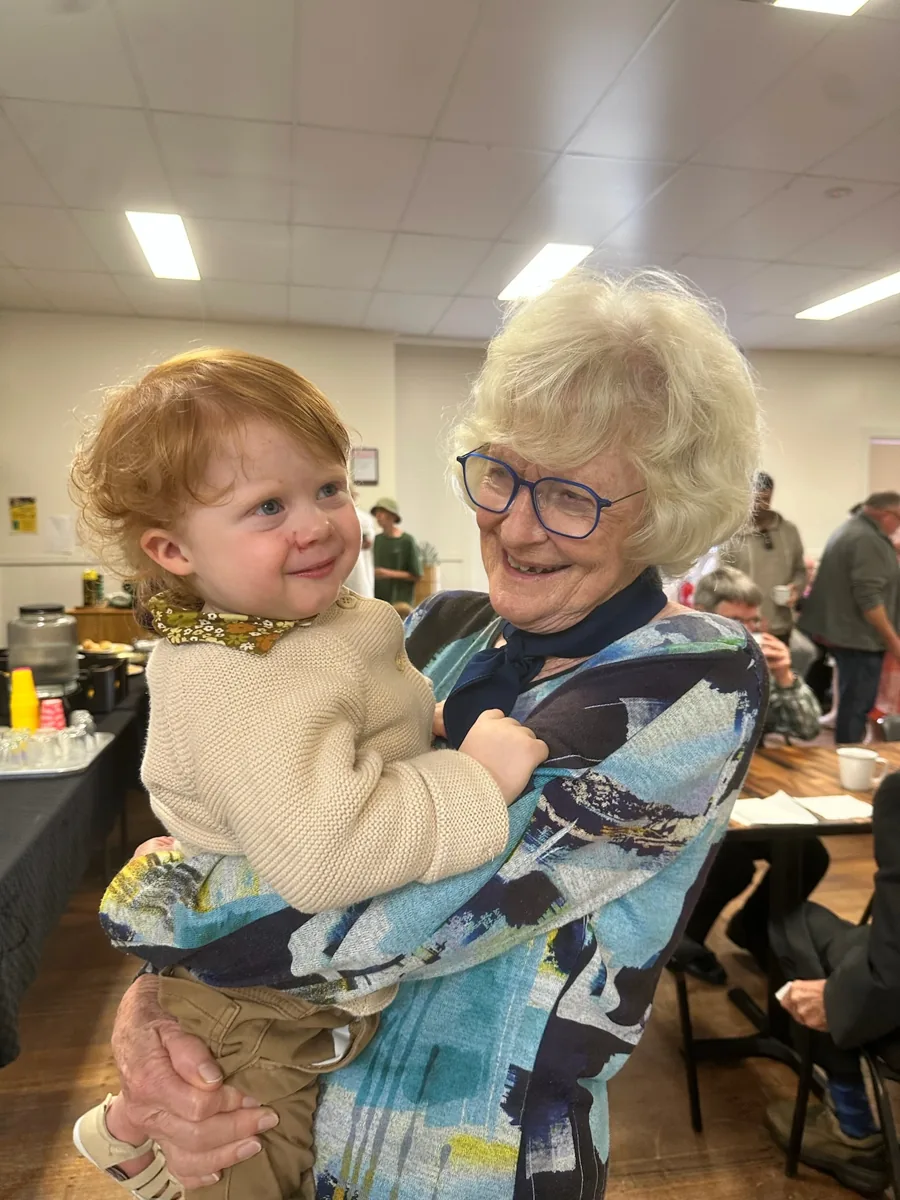 Different generations sharing a joyful moment at church