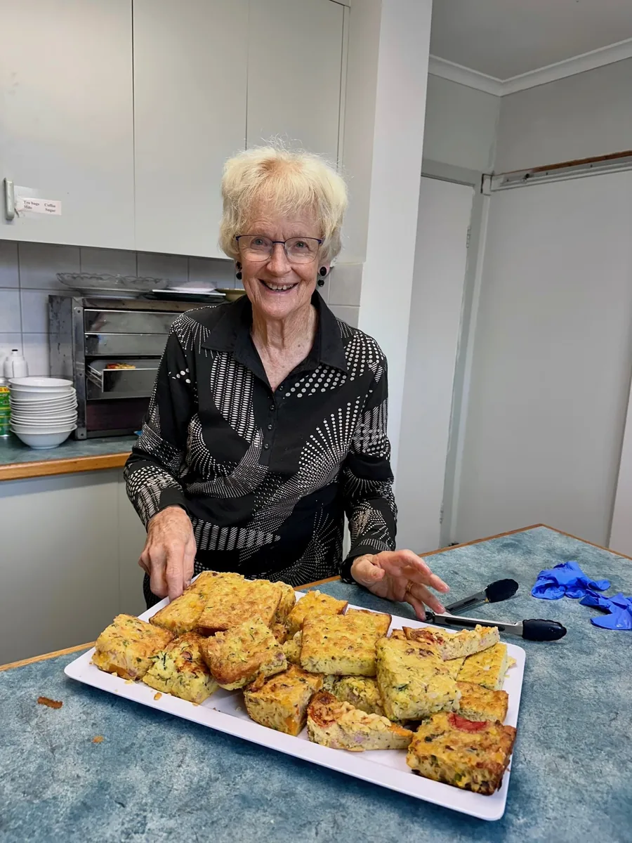 A church member sharing freshly baked food
